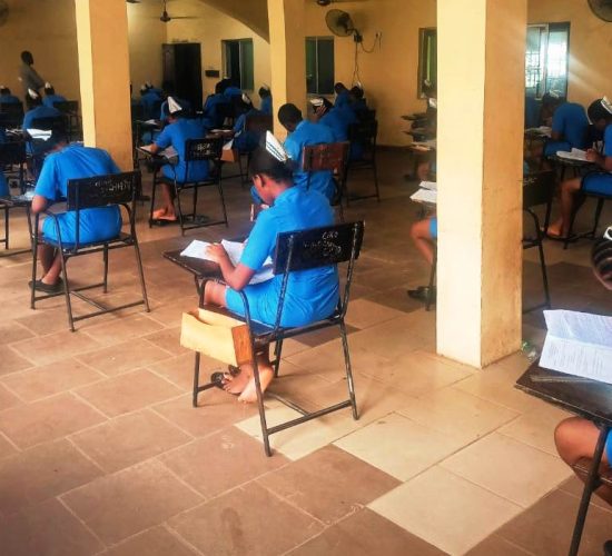 Students of SON Iyienu writing exam