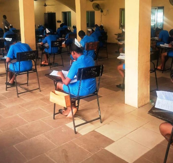 Students of SON Iyienu writing exam